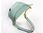 Stylish mint green leather fanny pack from VacationGrabs with gold chain strap and zipper closure