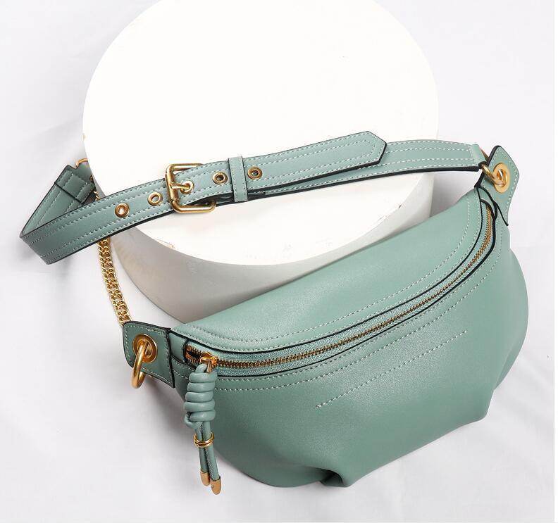 Stylish mint green colorful leather fanny packs with gold accents and zipper compartments