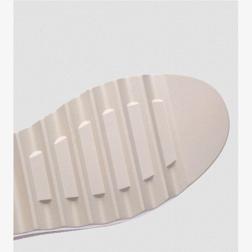 White sole of VacationGrabs colorful platform shoes for women with textured grip design
