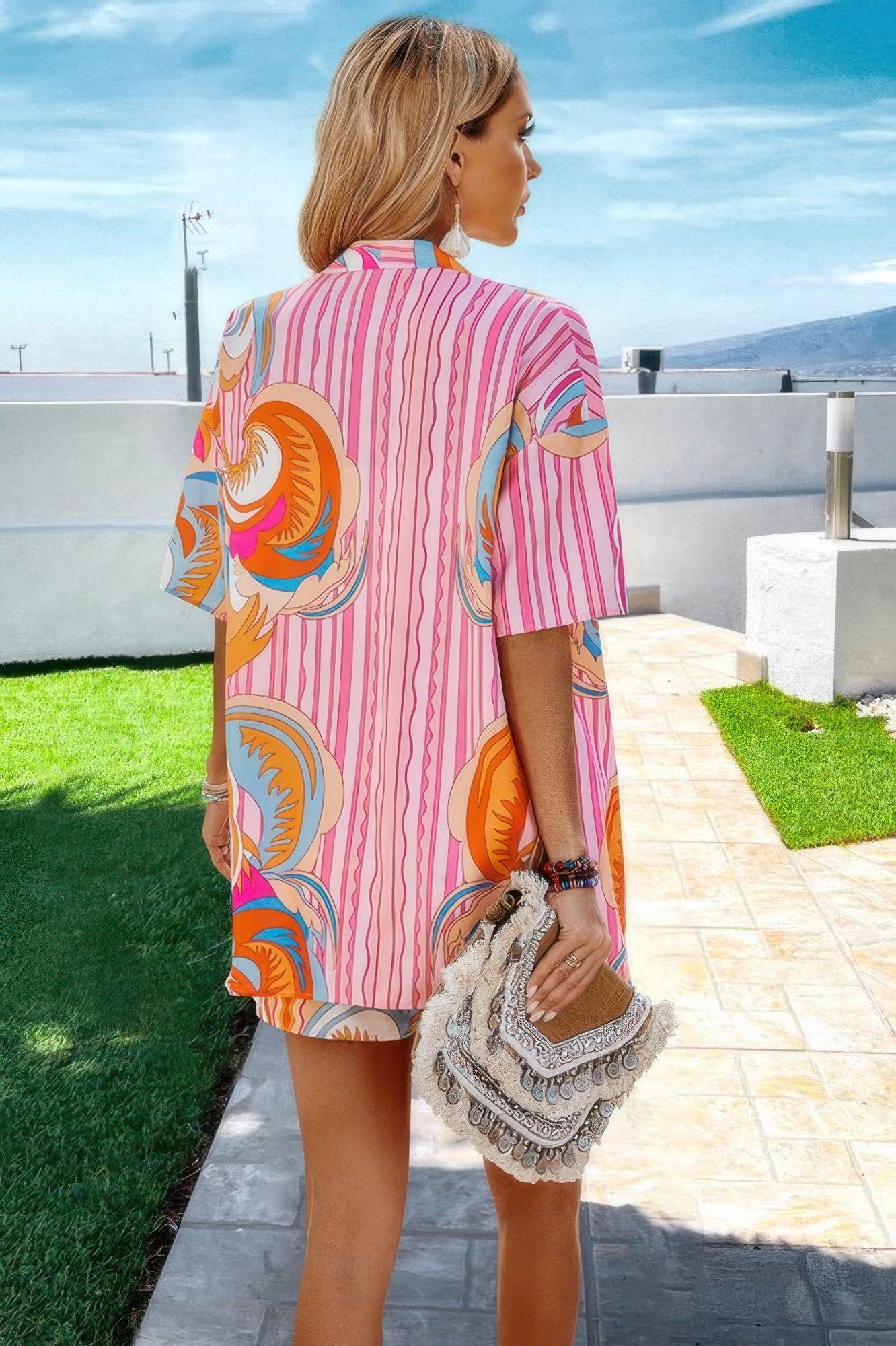 Women wearing colorful resort wear for women pink patterned short dress by VacationGrabs outdoors