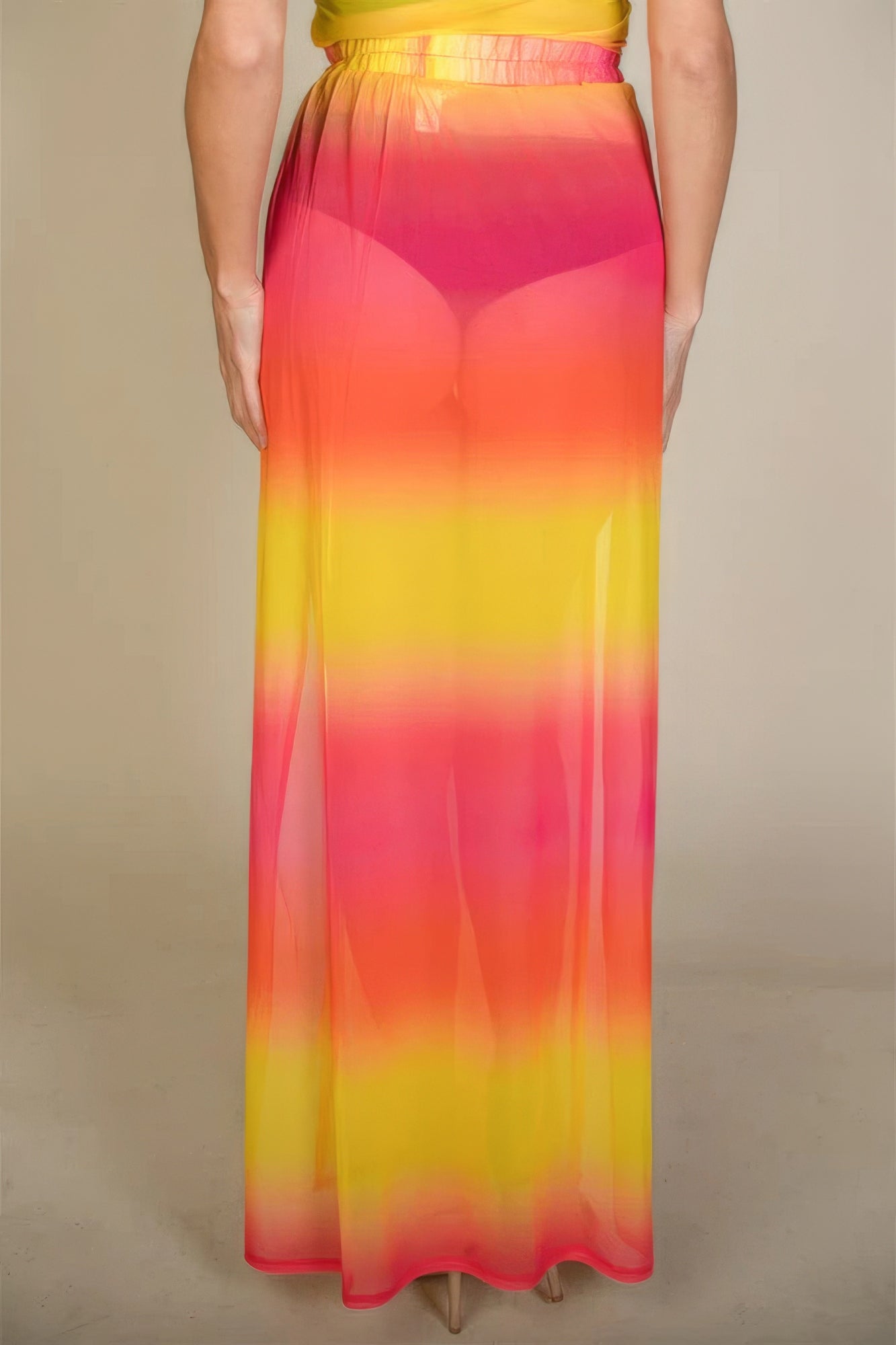 Colorful resort wear skirt from VacationGrabs featuring a sheer pink and yellow gradient design for women