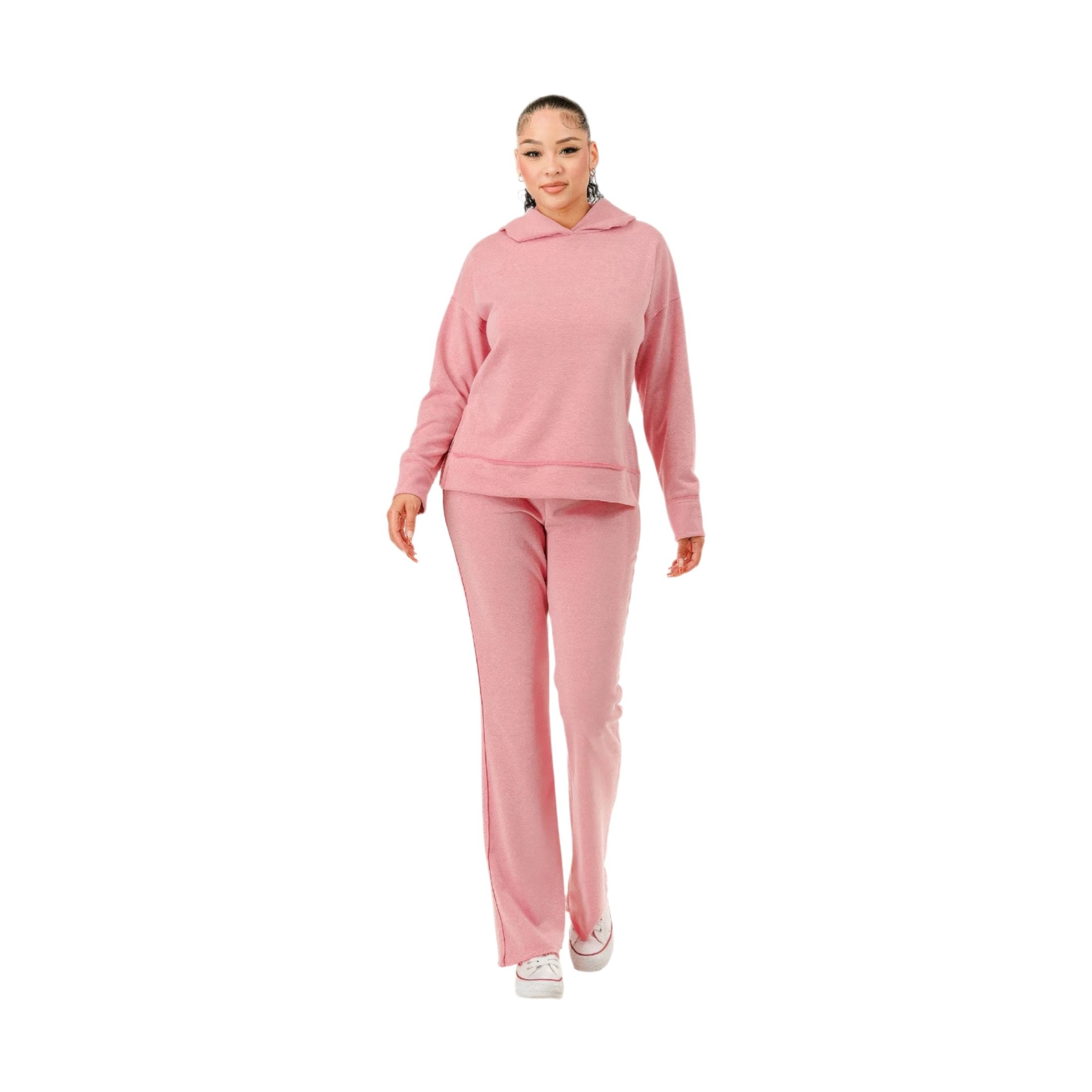 Woman wearing comfortable pink hoodie and pants set from VacationGrabs for casual wear