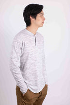 Man wearing a comfortable travel Henley shirt in light gray from Generation XYZ