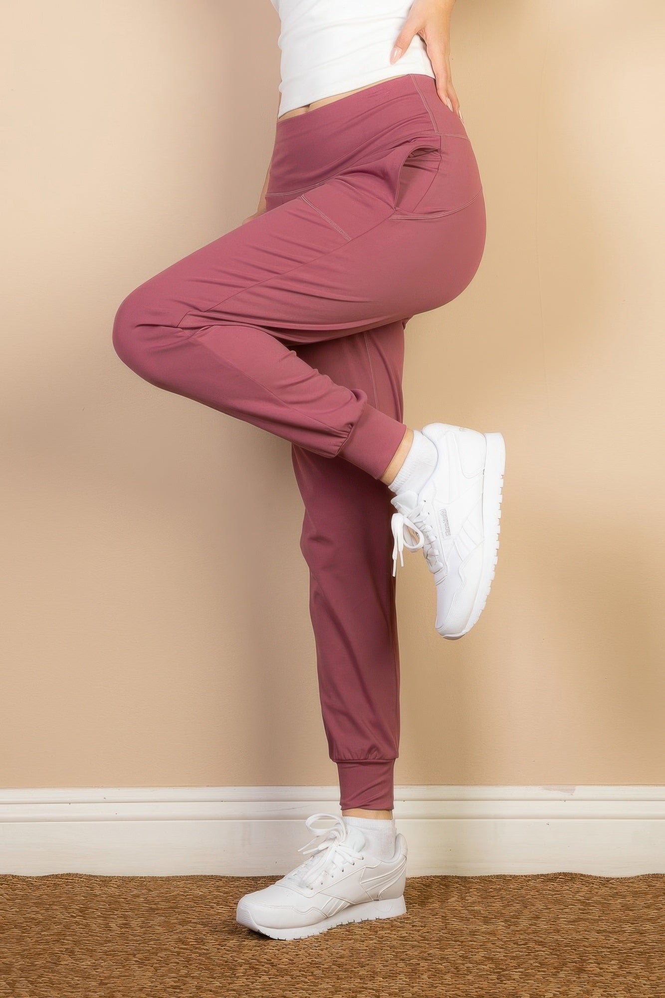 Women's comfortable travel joggers in mauve with elastic cuffs and side pockets