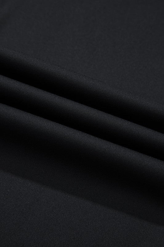 Smooth black fabric showcasing comfortable vacation leggings for women from JUNIPER BLVD