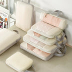 Vacuum-sealed compression packing cubes for travel in pastel colors
