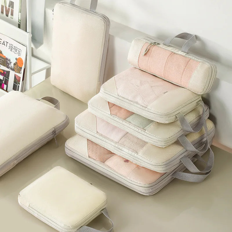 Vacuum-sealed compression packing cubes for travel in pastel colors