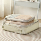 Compression packing cubes for travel in pastel colors with zippered closures