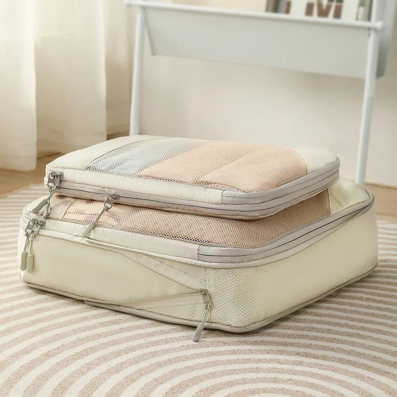 Compression packing cubes for travel in pastel colors with zippered closures