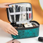 VacationGrabs multi compartment cosmetic bag in teal with organized makeup brushes and toiletries