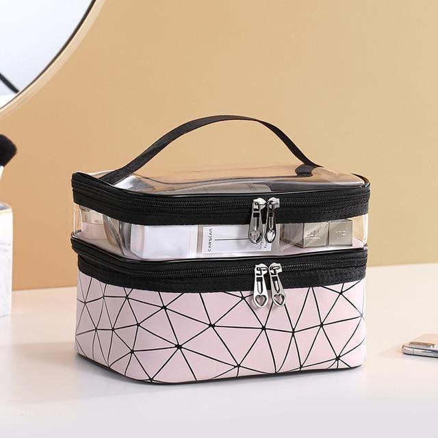 VacationGrabs multi compartment cosmetic bag in pink and black with clear top for easy access to toiletries