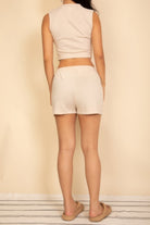 Back view of women's cotton French terry crop top and shorts set in neutral color by VacationGrabs