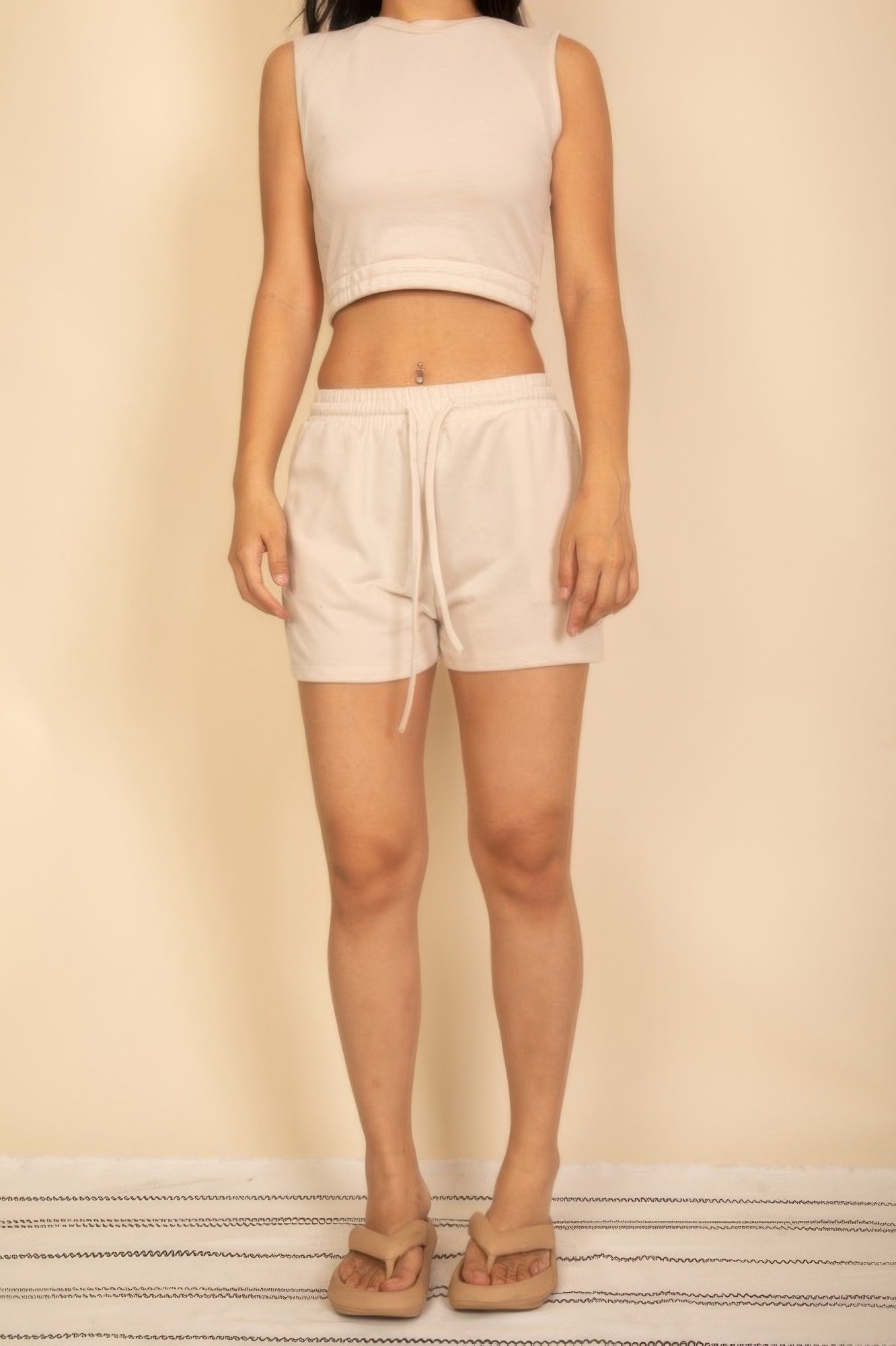 Stylish women's cotton French terry crop top and shorts set in a light color for summer comfort