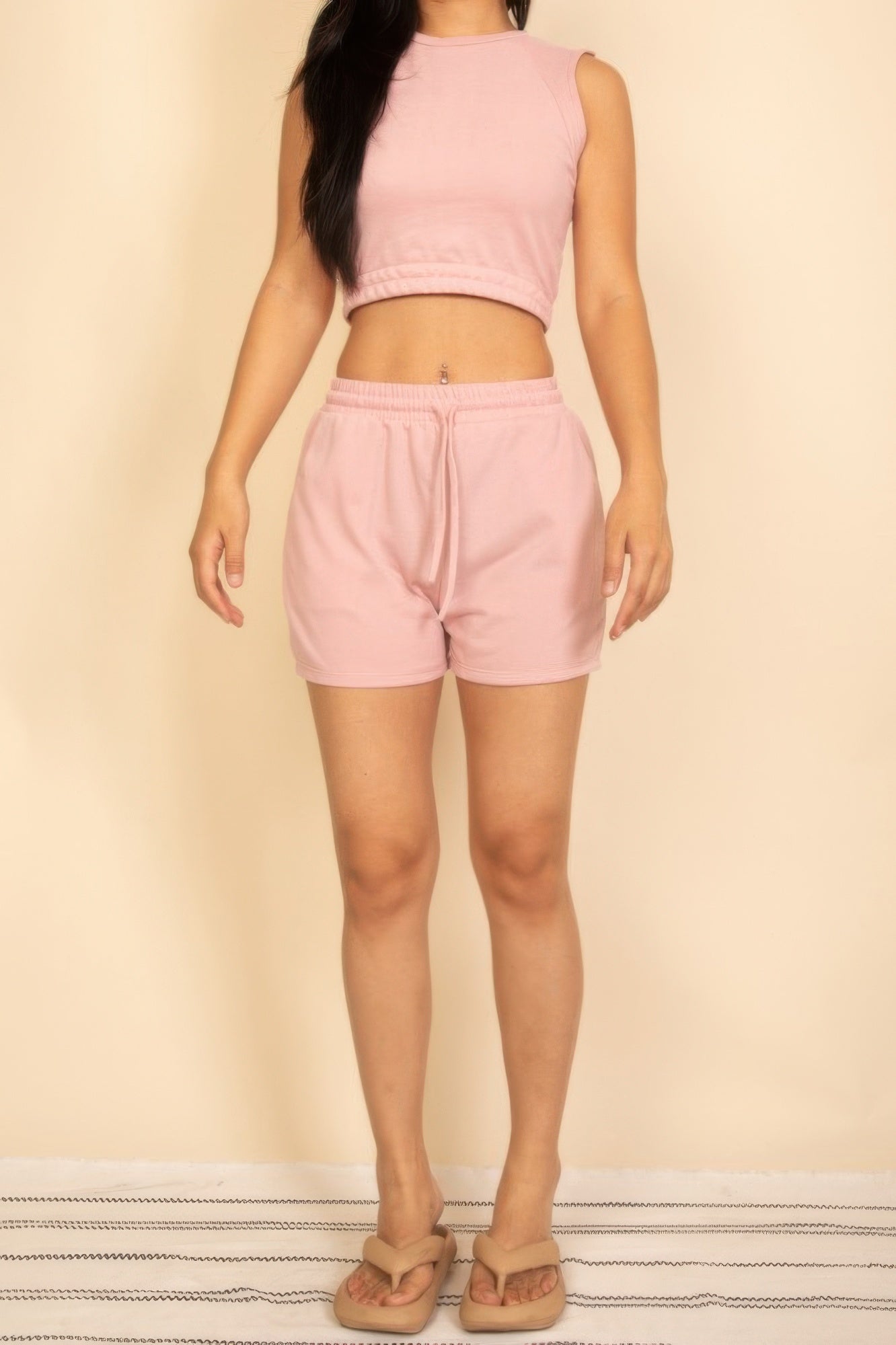 Women's cotton French terry crop top and shorts set in soft pink, perfect for casual summer outings