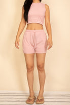 Women's cotton French terry crop top and shorts set in soft pink, perfect for casual summer outings