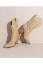 Women's beige cowboy western boots with decorative stitching for stylish outfits