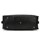 Bottom view of a durable cowskin leather travel bag with protective feet for stability