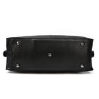 Bottom view of a durable cowskin leather travel bag with protective feet for stability