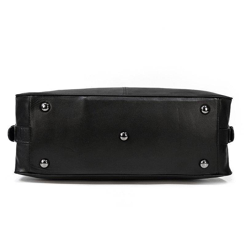 Bottom view of a durable cowskin leather travel bag with protective feet for stability