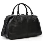 Stylish black cowskin leather travel bag with durable handles and spacious interior