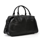 Stylish black cowskin leather travel bag with durable handles and spacious interior