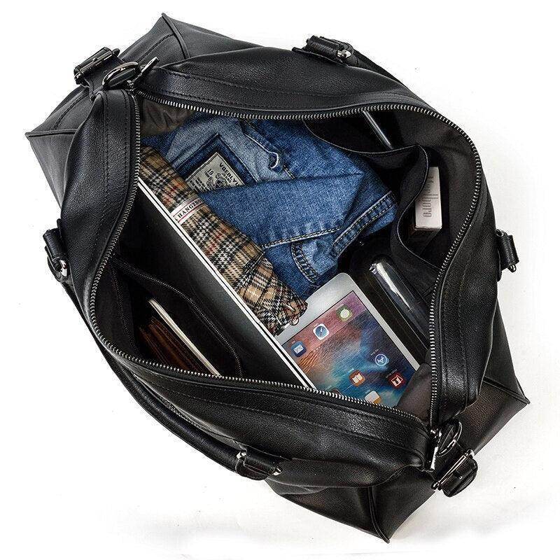 Cowskin leather travel bag with spacious interior holding clothing, gadgets, and travel essentials