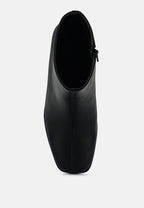 Bottines Chelsea à talons blocs et découpes Cox