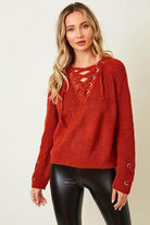 e Luna cozy knit lace-up sweater in rust color with lace-up front detail and long sleeves