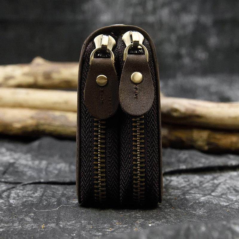 Close-up of a crazy horse leather wallet featuring double zippers for secure storage and durability