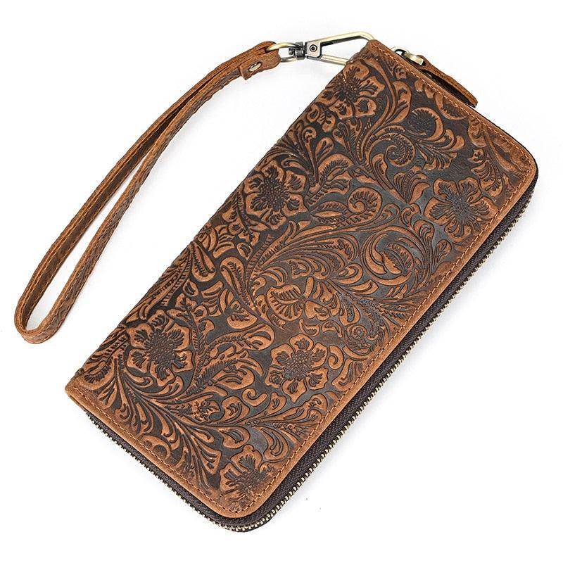 Crazy horse leather wallet with intricate floral pattern and wrist strap for stylish convenience