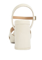 Women's beige criss cross block heel sandals for stylish occasions