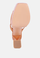 Underside view of London Rag International croc high heel platform sandals showing detailed sole pattern