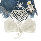 Crocheted bikini top on a white background with denim and flowers.