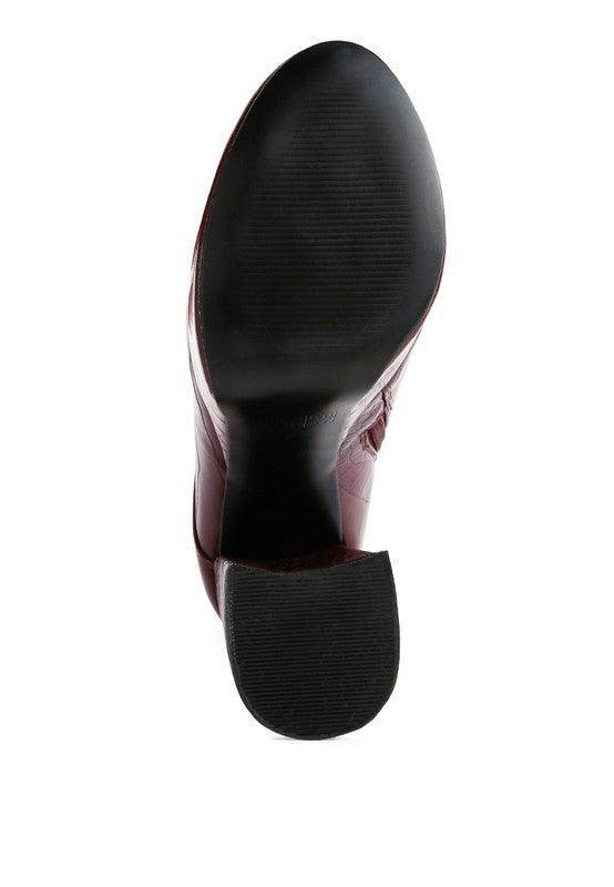 Bottom view of Rag Company crocodile pattern platform boots showcasing rubber sole for stability