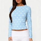 Women's blue polka dot crop top in soft material, perfect for casual outings