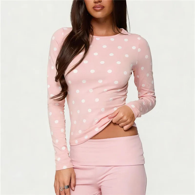 Women's polka dot crop top in pink, perfect for casual outings