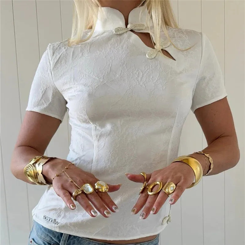 Women's white crop top with unique button design for casual wear