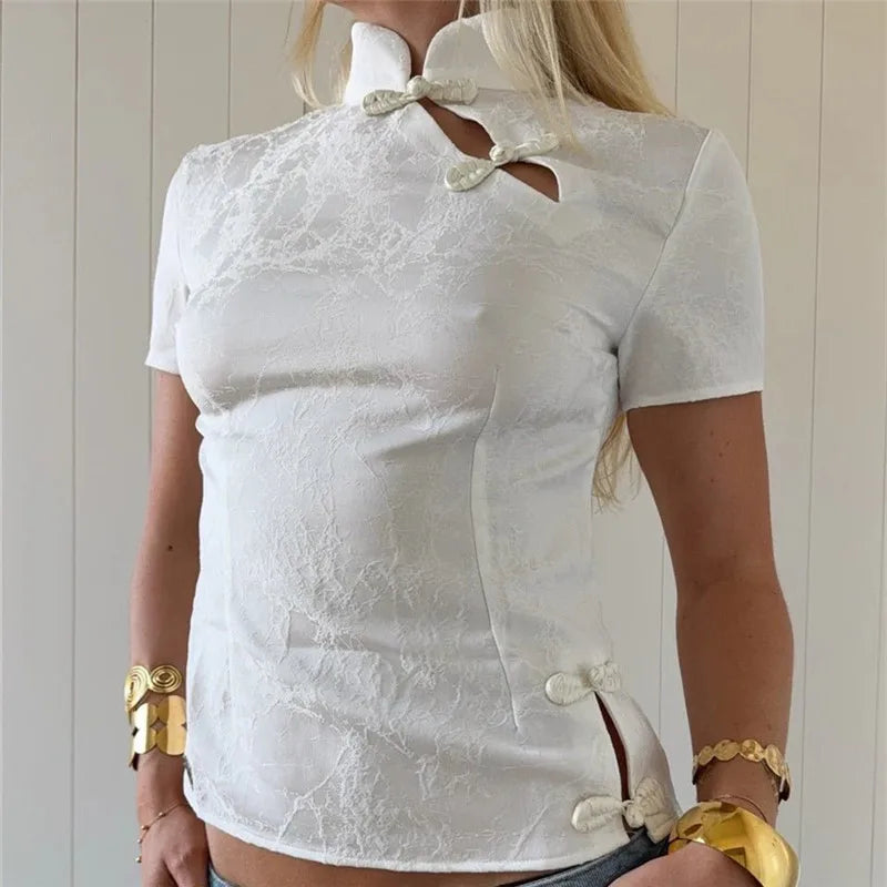 Women's white crop top with unique cutouts, perfect for casual outings