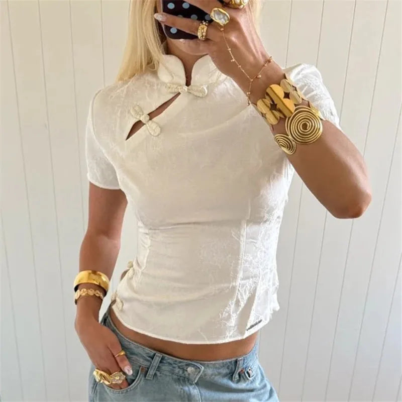 White crop top with unique buttons, perfect for summer outings