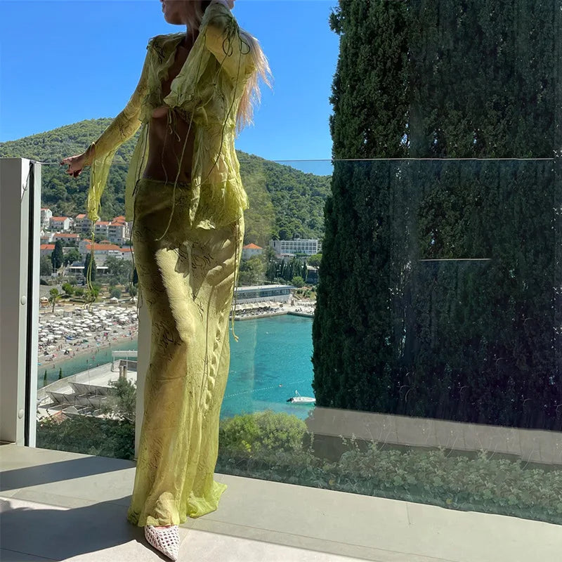 Women's sheer yellow cover-up set with crop top, perfect for beach outings