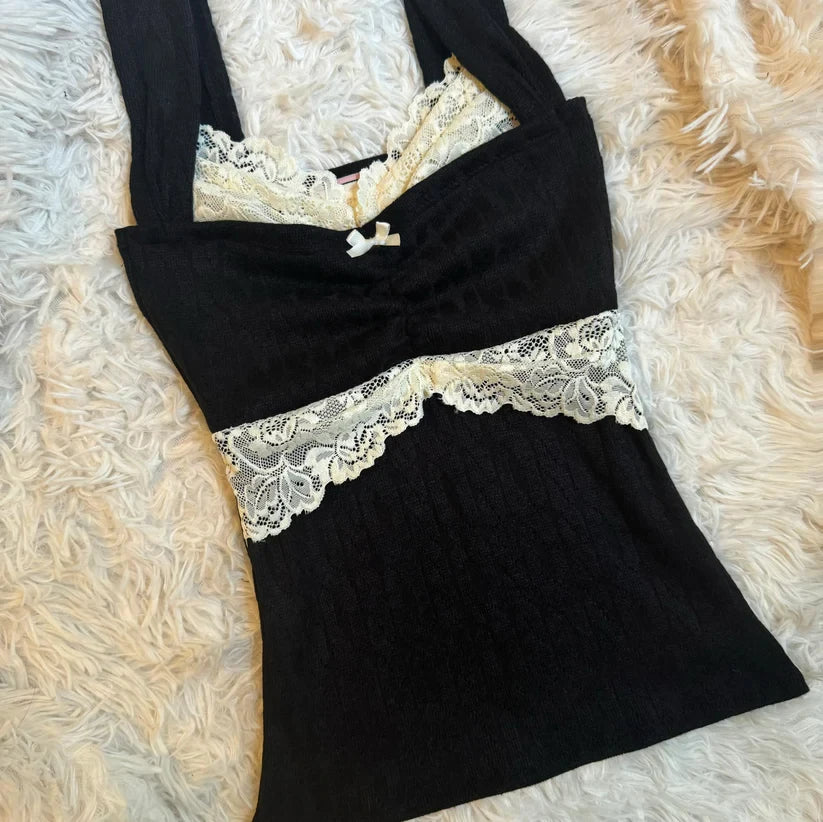 Women's black crop top with lace detailing, perfect for casual outings