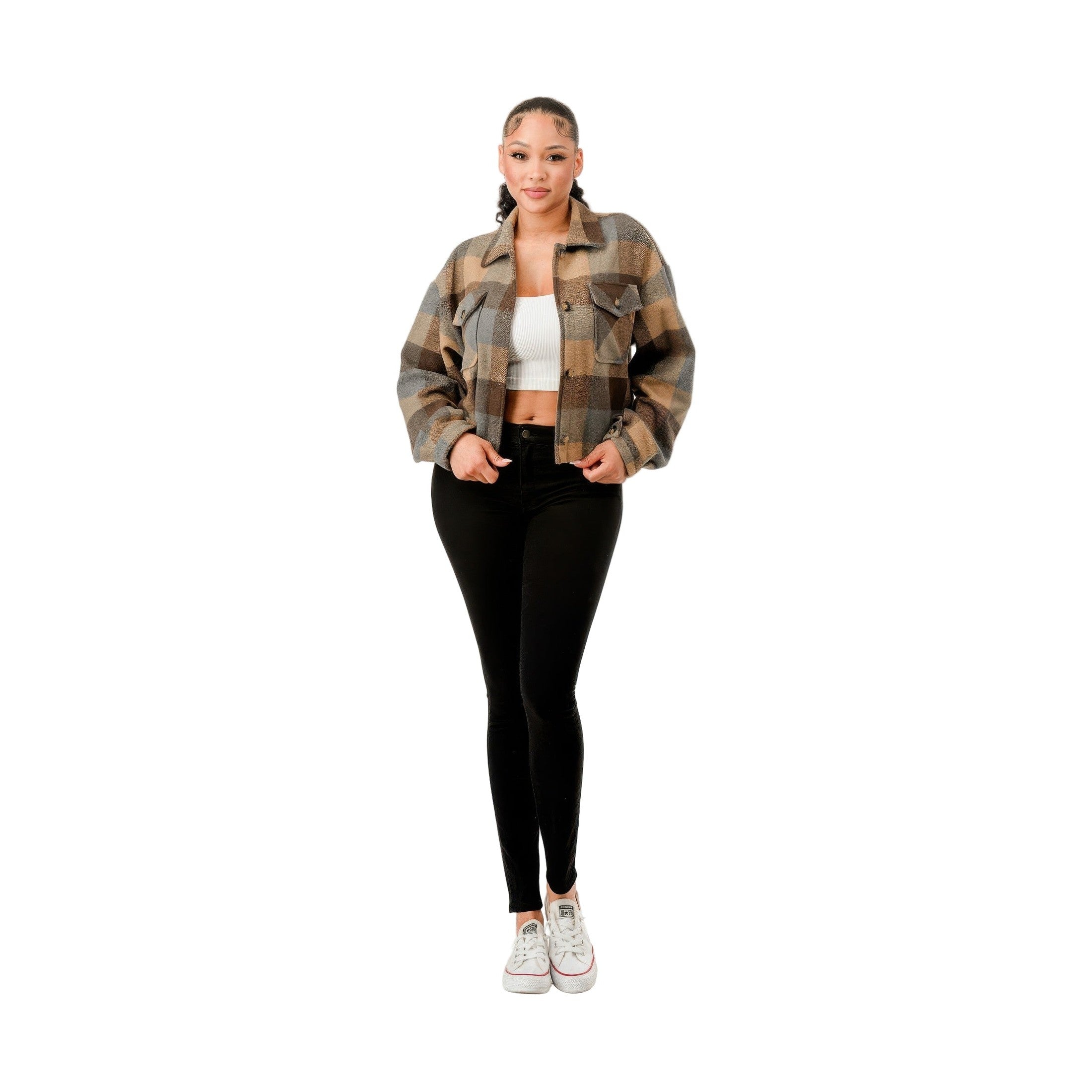 Model wearing a cropped brown flannel jacket paired with black leggings and white sneakers