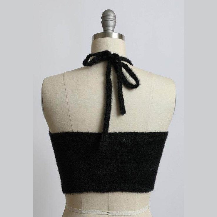 Back view of a Leto Accessories cropped fuzzy halter top in black with stylish tie detail