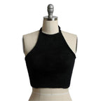 Leto Accessories cropped fuzzy halter top in black, featuring a stylish design and soft texture