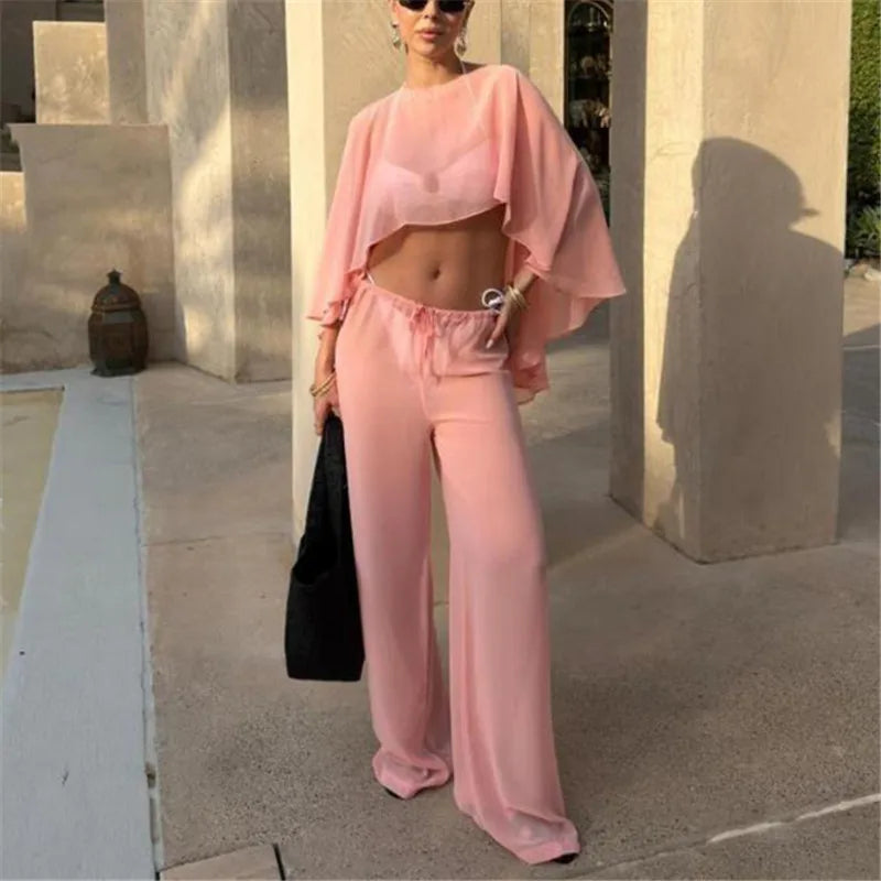 Women's cropped top and matching pants set in soft pink, perfect for summer outings