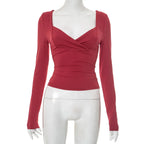 Women's red long-sleeve cropped top, perfect for casual outings