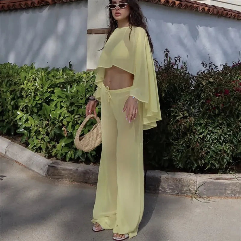 Women's yellow cropped top and wide-leg pants set for summer outings