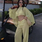 Women's yellow cropped top and matching pants, perfect for beach outings