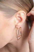 Cut out geometric earrings for women in rose gold, stylish design for modern accessories