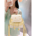 Cute cheese backpack in yellow and white with playful polka dots for trendy outings